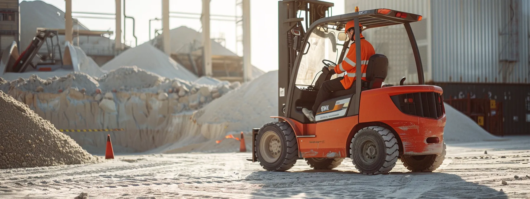 a rental company employee undergoing environmental compliance training while inspecting a forklift against a backdrop of sand-handling structures.