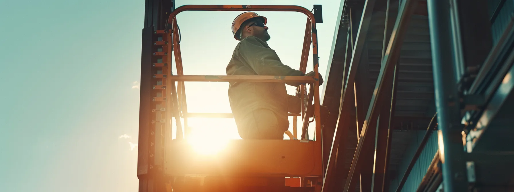 a construction worker effortlessly operating a state-of-the-art man lift with arrow material handling system, increasing efficiency and safety at the worksite.