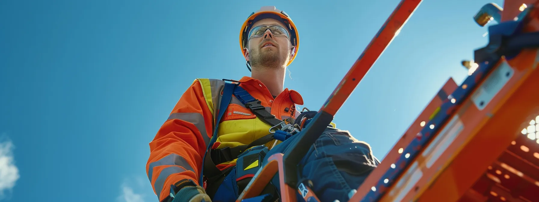 a worker securely fastening a hydraulic man lift attachment onto a scissor lift, with lanyards and pins visible, ensuring safe and efficient access to elevated work areas.